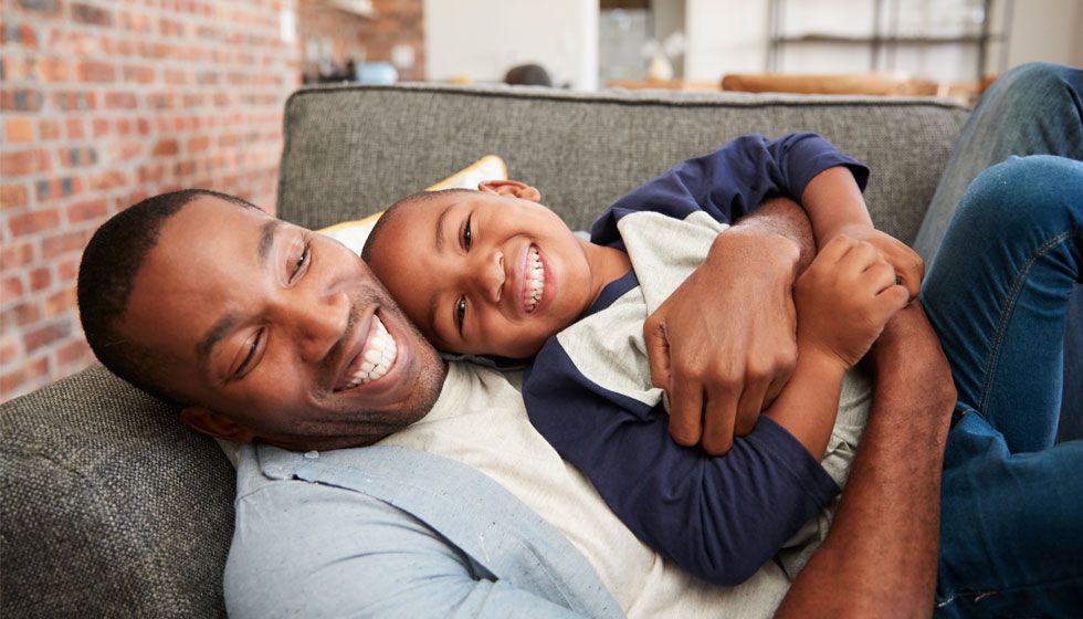 father and son laughing